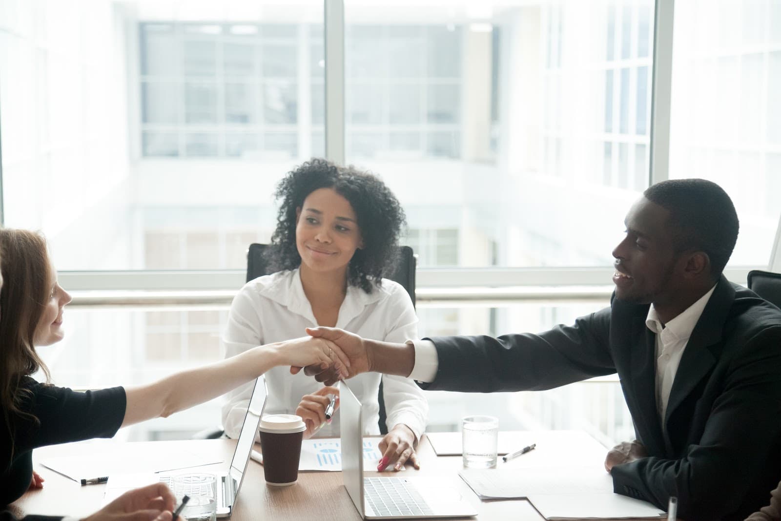 woman and man shaking hands