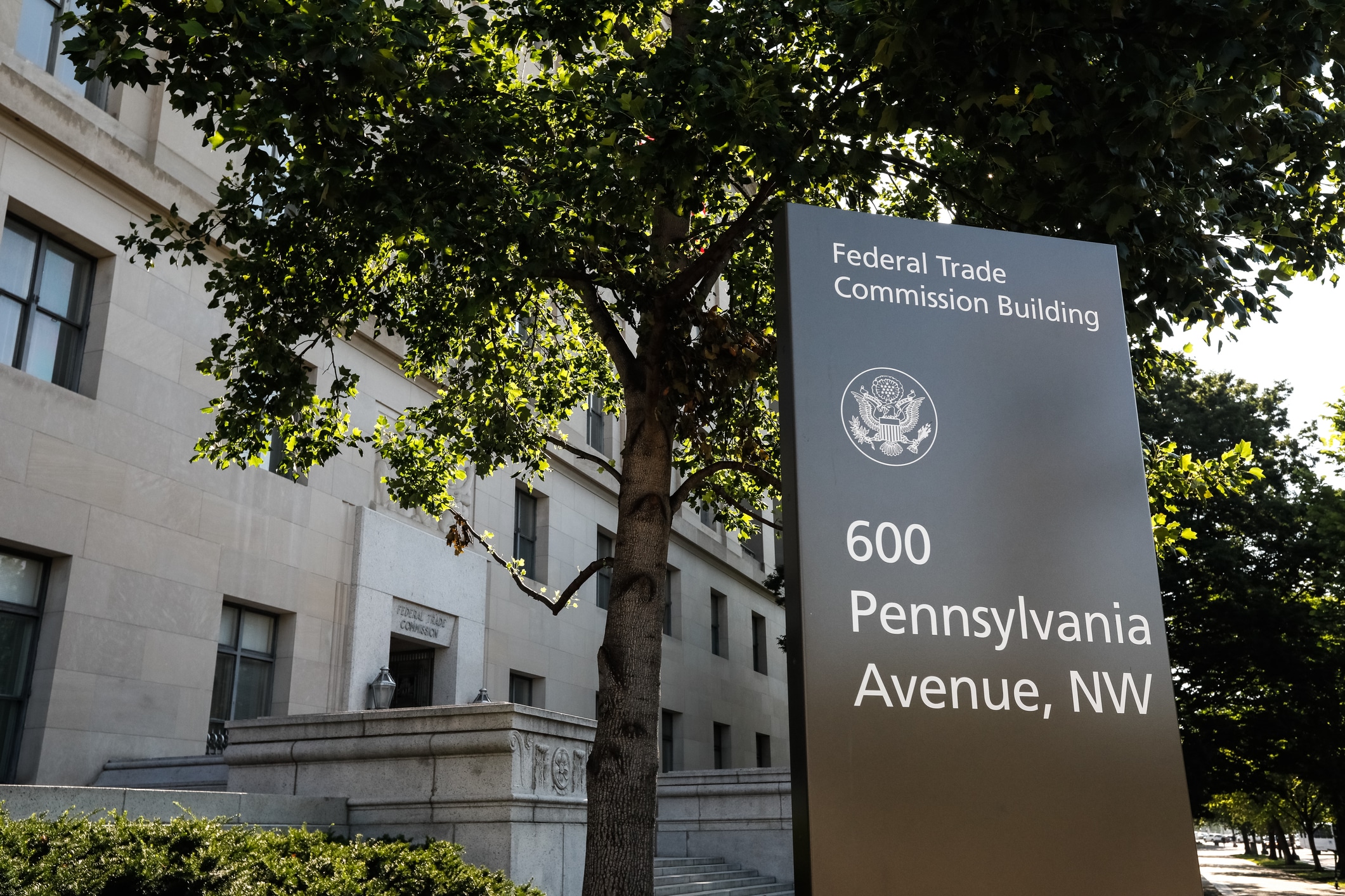 Washington, D.C., USA - July 19, 2019: This is the exterior view of the street sign in front of the US Federal Trade Commission headquarters. The FTC is the governmental agency tasked with regulating commerce and business practices for the federal government