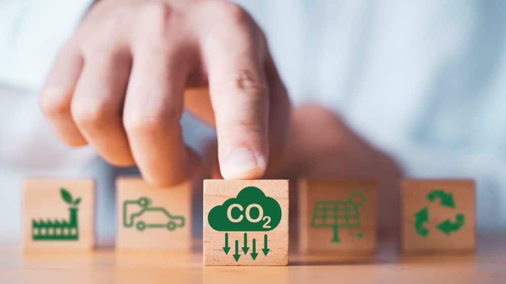 man pointing on block that says carbon dioxide