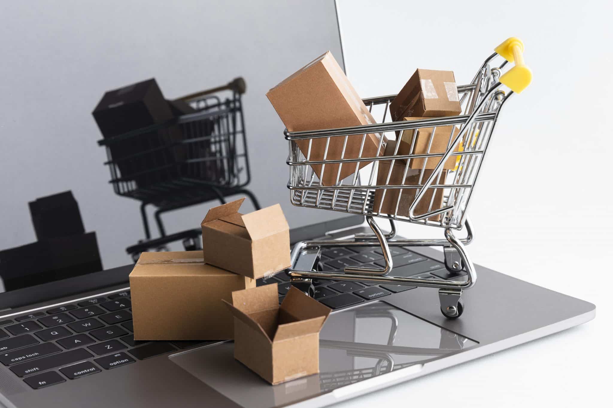 mini shopping carts on top of a laptop