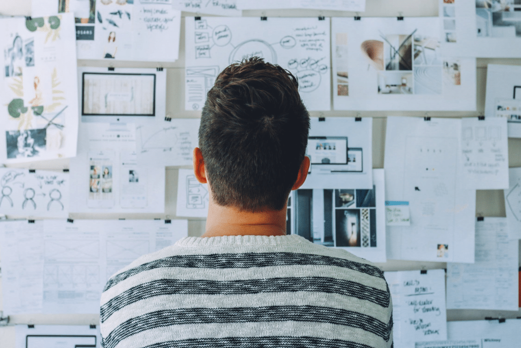 Man looking at a board