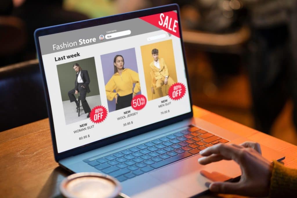 someone using the laptop to buy clothes online.