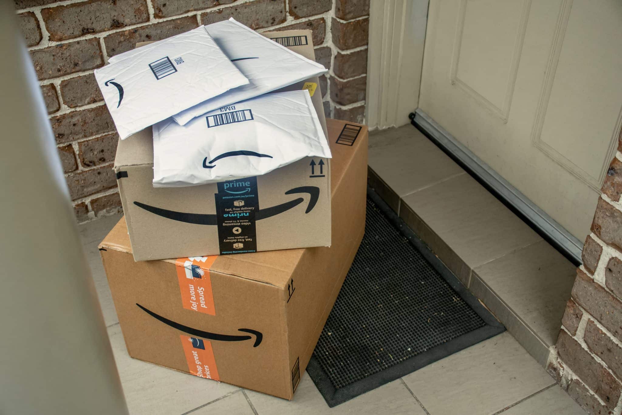 Amazon packages in front of a door