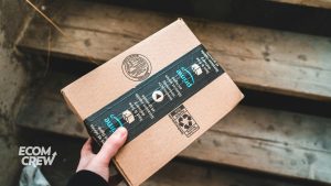 Image of person holding Amazon prime delivery box.